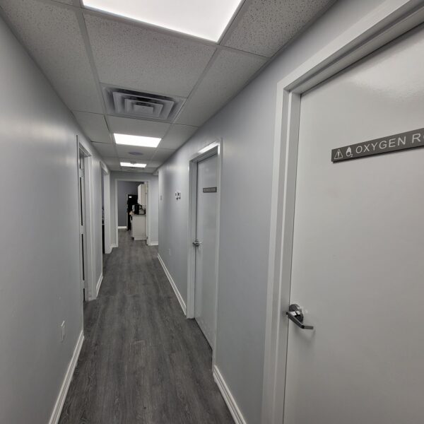 Medical clinic corridor with oxygen room signage built to Ontario code