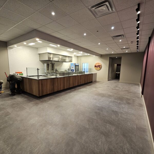 Franchise construction in progress with kitchen and serving counter being built