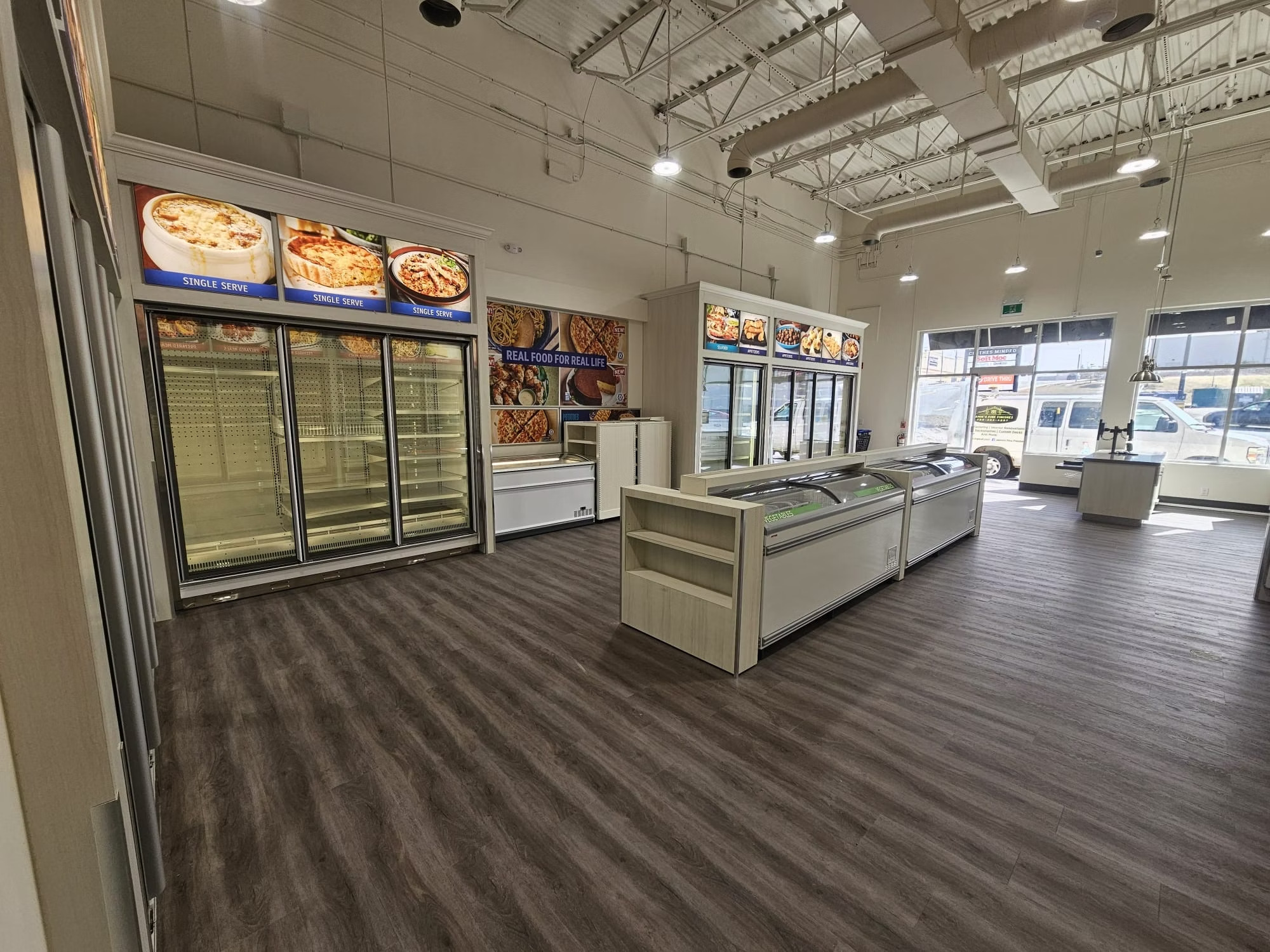 M&M Food Market Store #244 completed retail interior with display freezers and signage